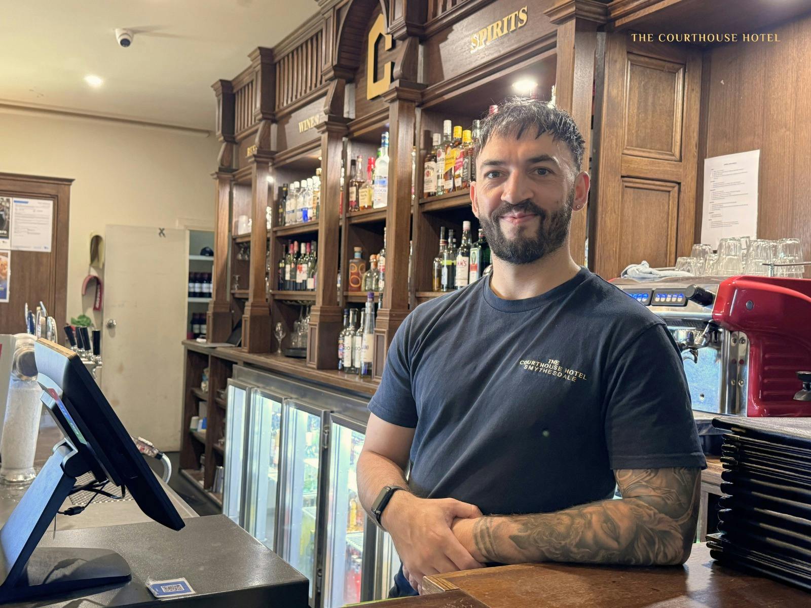Friendly staff providing welcoming service behind the bar at the Courthouse Hotel.