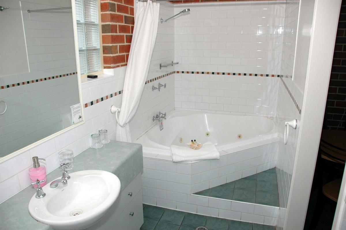 Large Corner Spa Bath