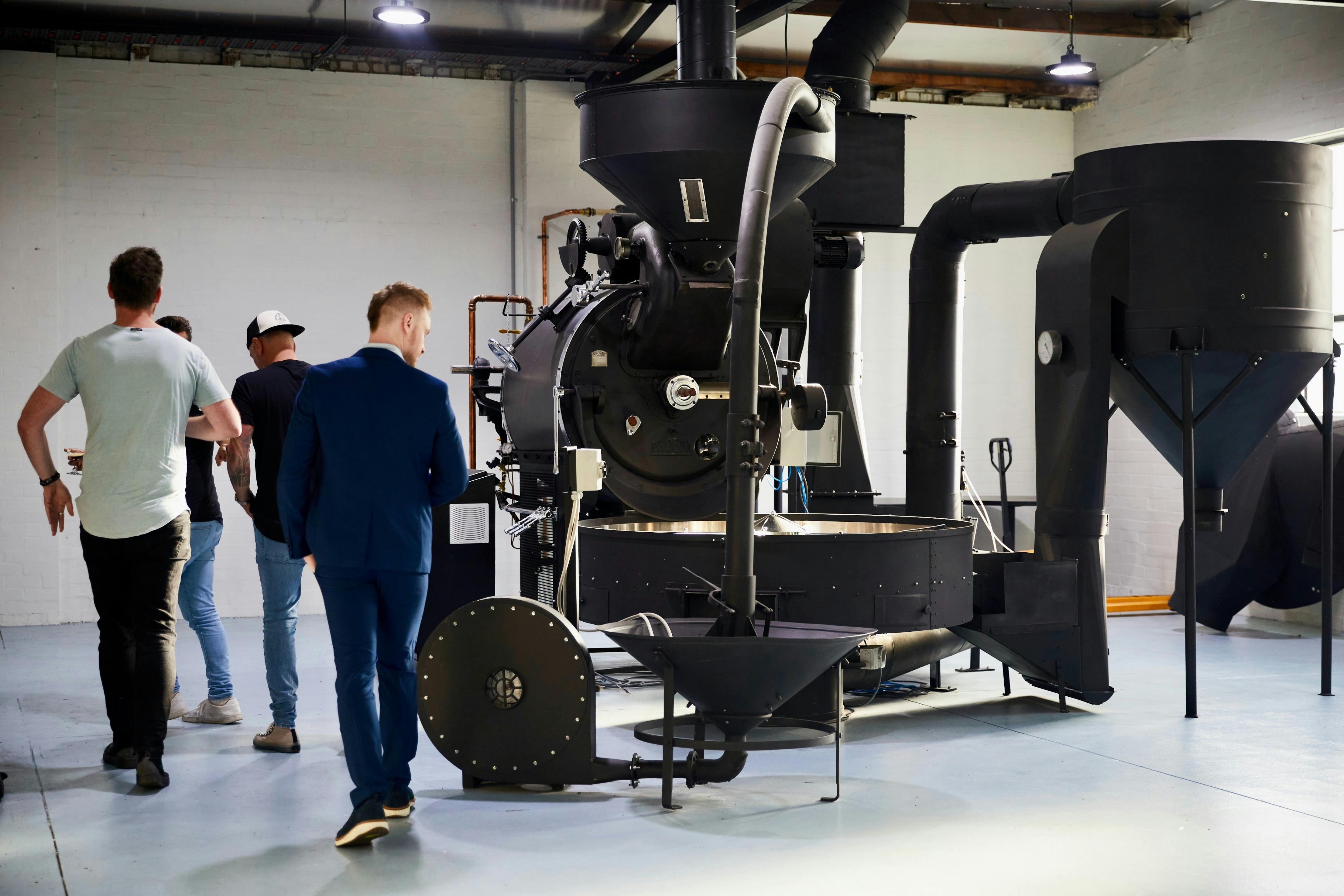Guests Explore the industrial coffee roaster