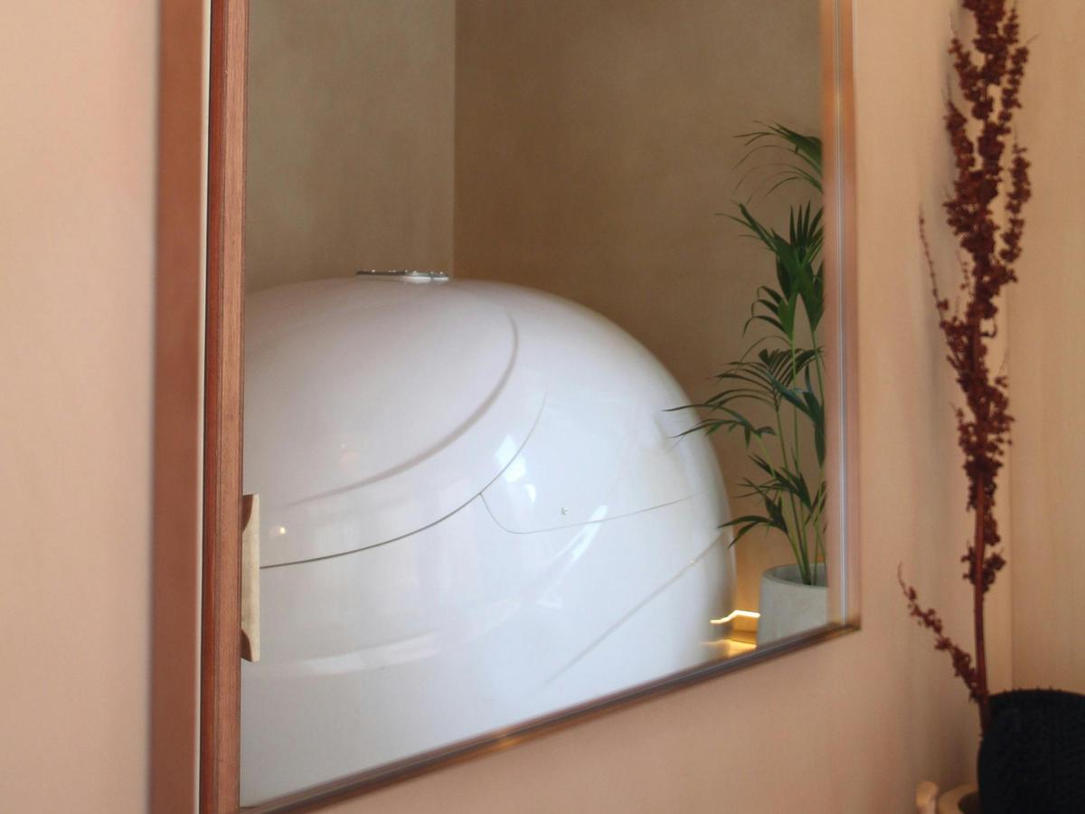 Magnesium Float tank within a private treatment space at Flo Alchemy.