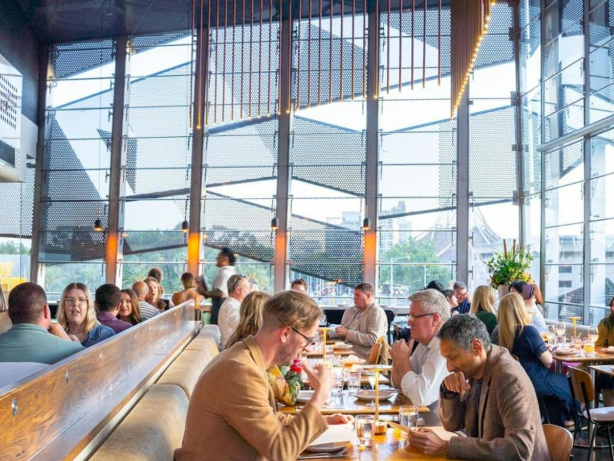 People Dining in Taxi Kitchen Main Dining Room with views of the Arts Centre
