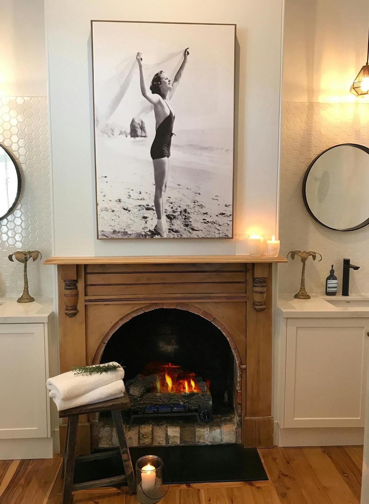 Bathroom with open gas log fire at The Old Butcher’s House