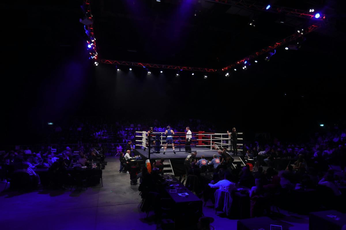 Wide shot of ring with crowd in background