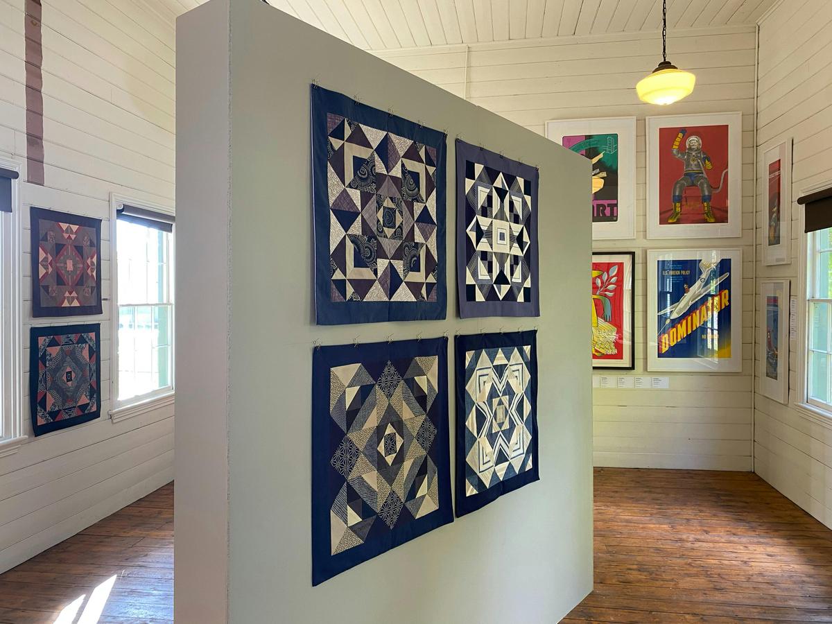 A purpose-built wall brings flexible hanging to this warm, heritage timber interior.