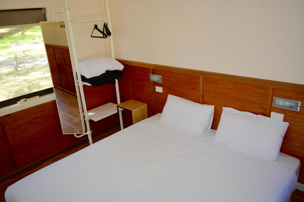 Standard Cabins - shared bathroom - king size bed.