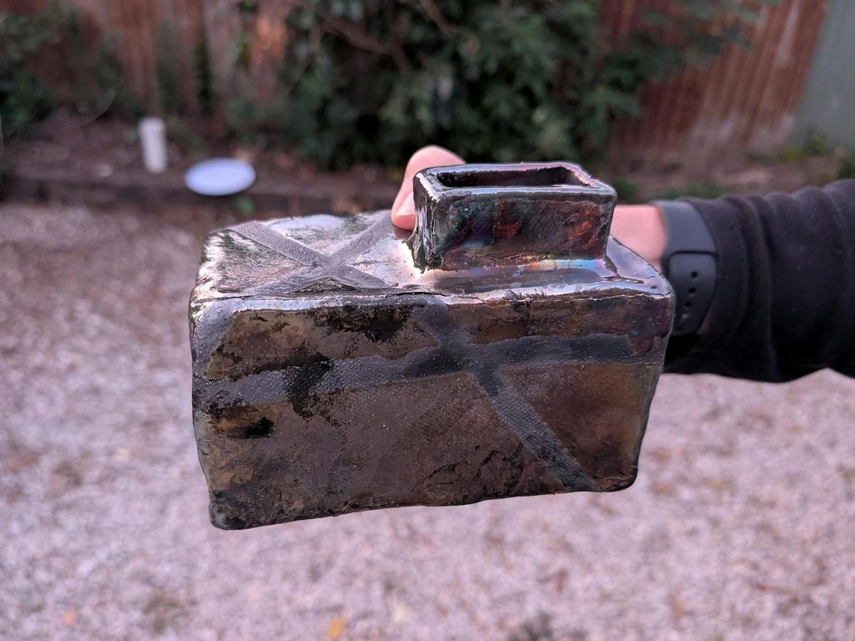 A glazed raku pot