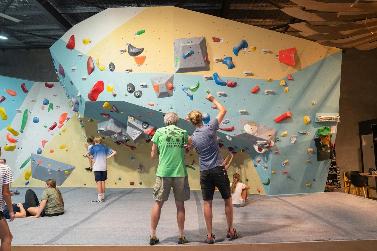 Two climbers assessing the routes