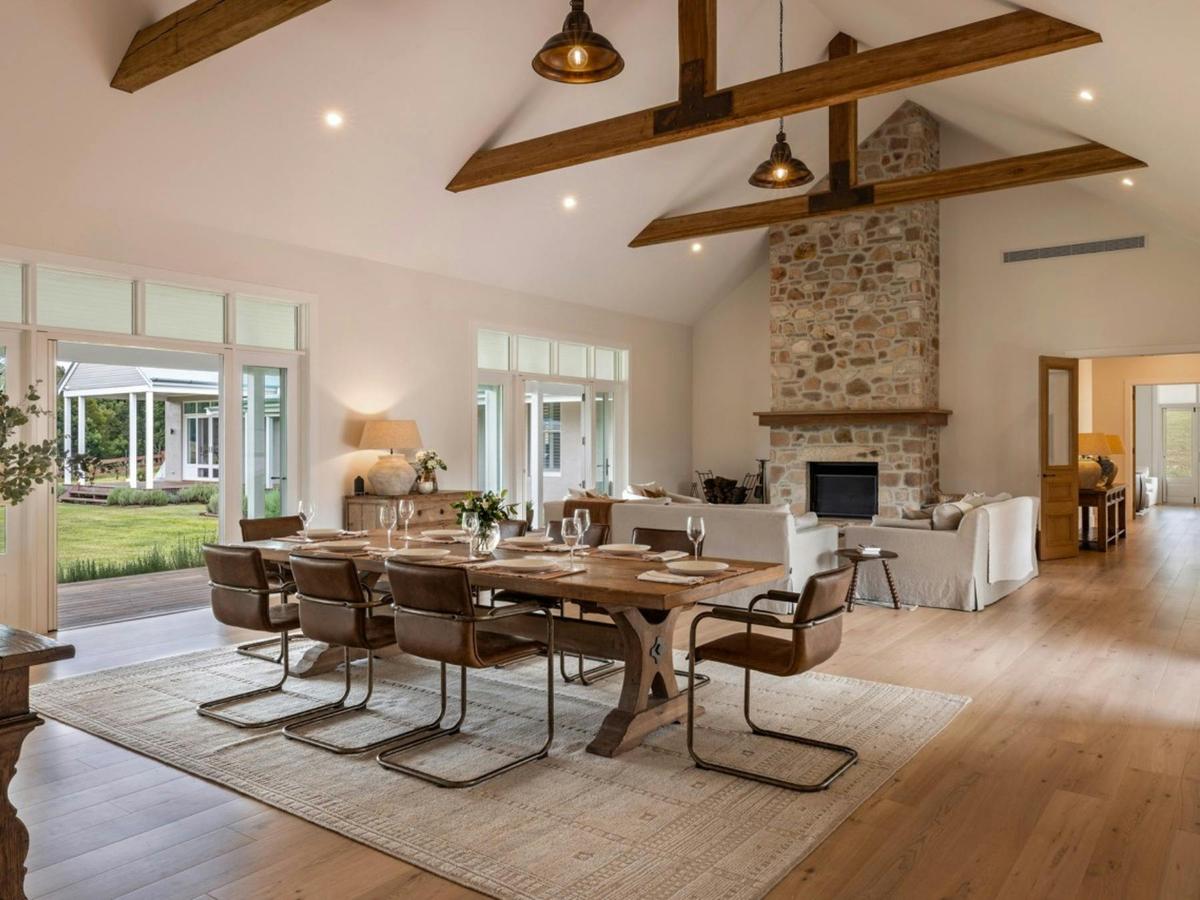 Open plan living and dining space with vaulted ceilings