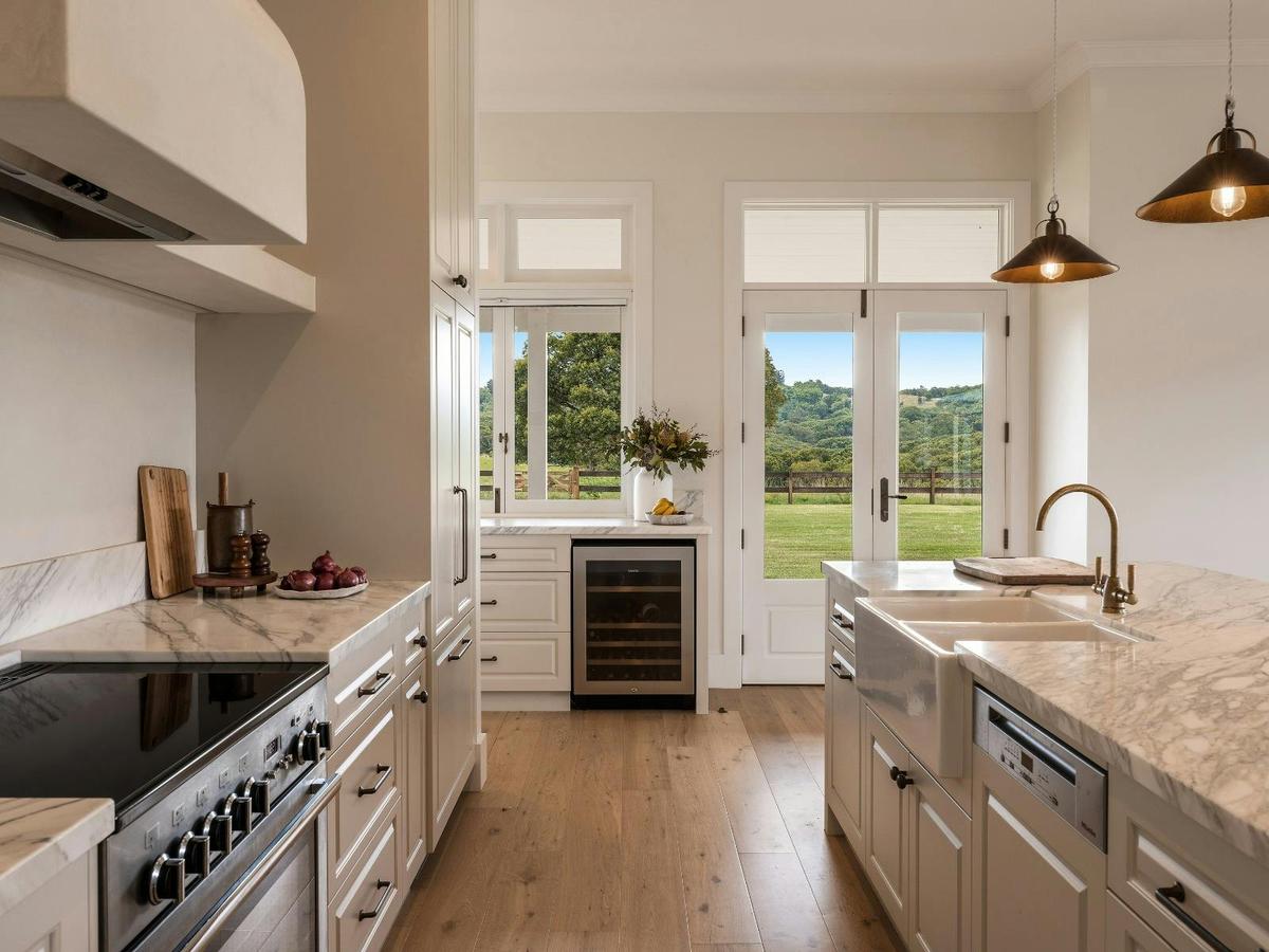 Light filled country kitchen opening to sweeping Byron hinterland views.
