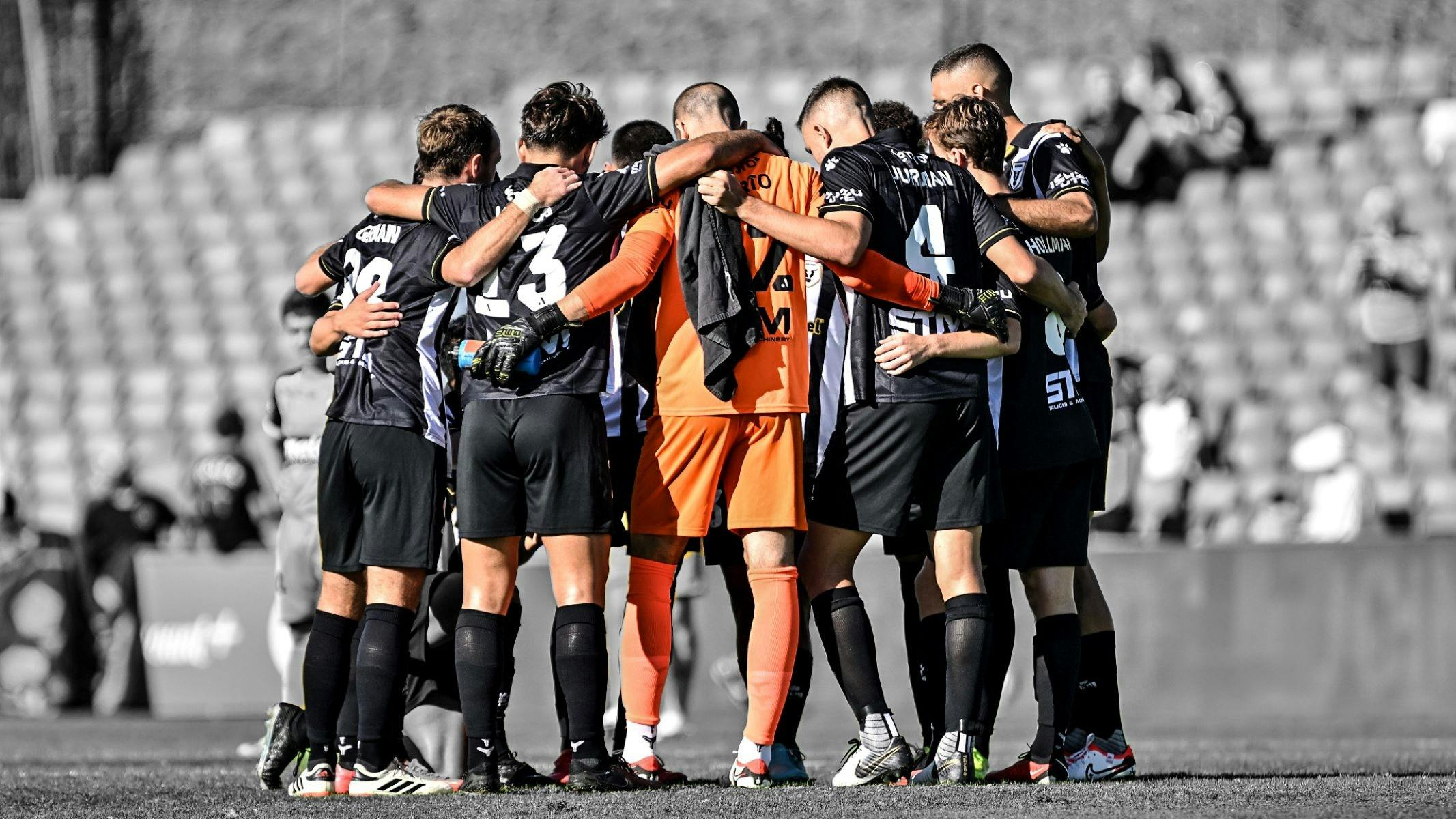 macarthur fc players in a huddle