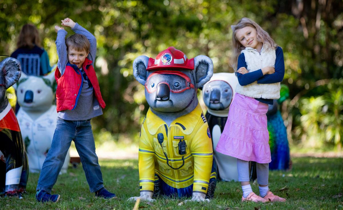 Josh and Jemma have fun with Hello Koalas sculpture Frankie Firefighter