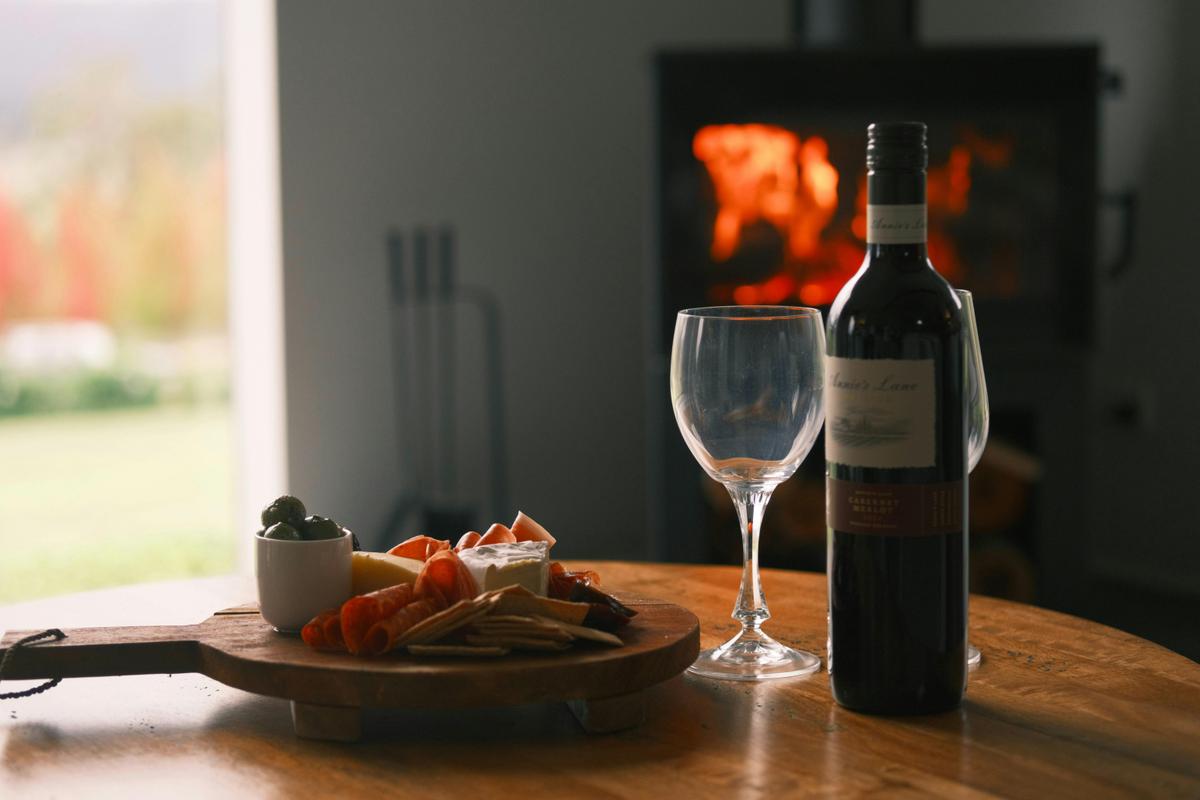 Enjoy a complimentary bottle of wine near the combustion wood fire
