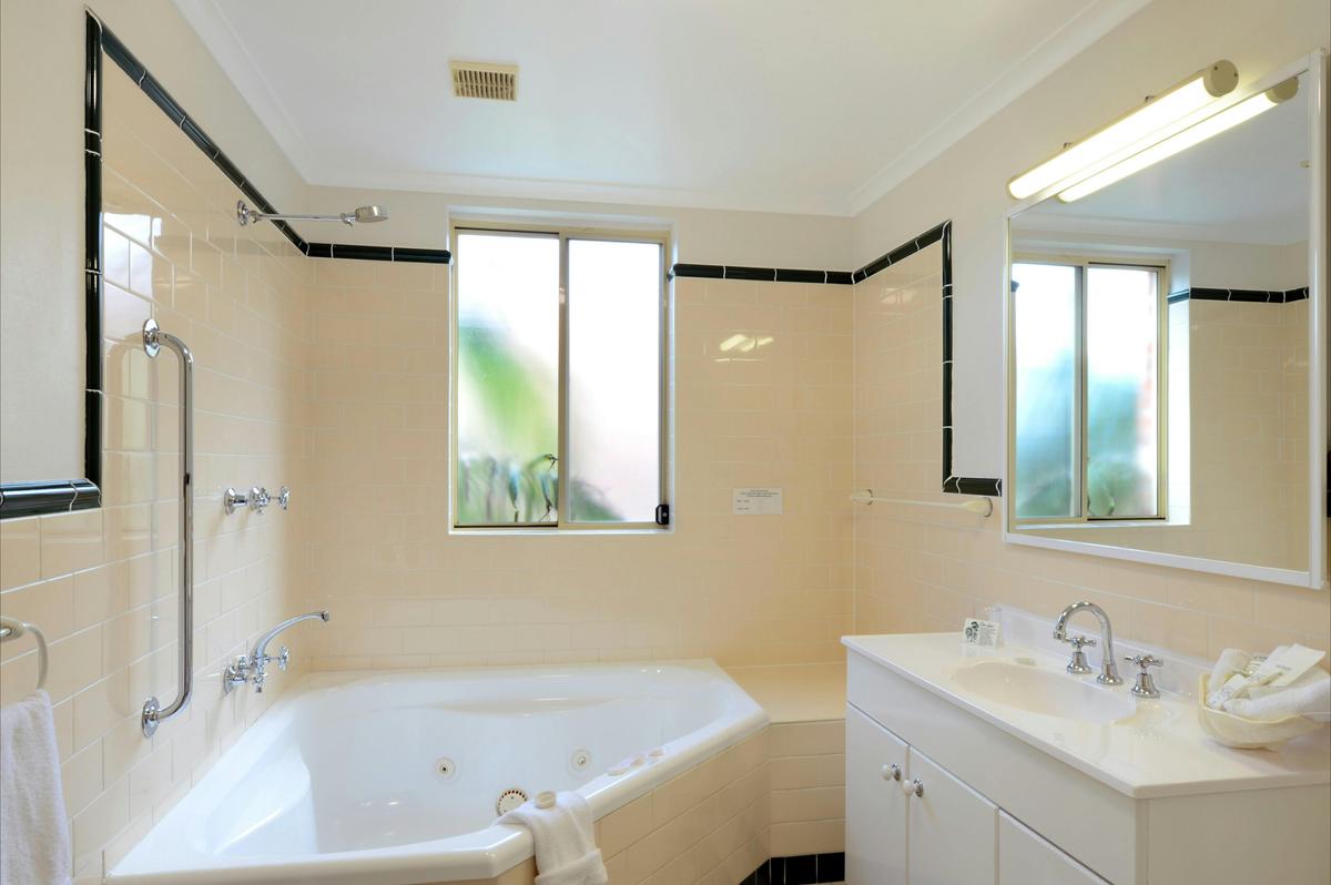 Spa bathroom, two bedroom poolside apartment