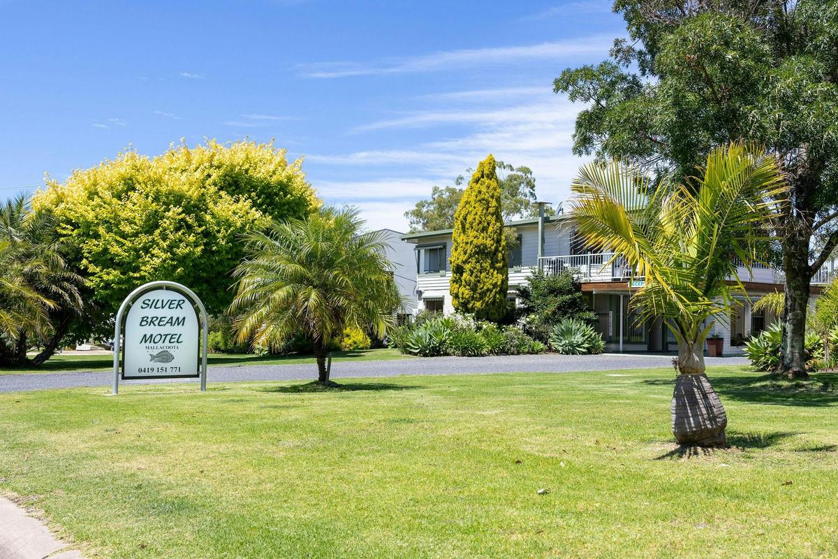 Silver Bream Motel sits on a quiet, palm-lined block, a short stroll from town.