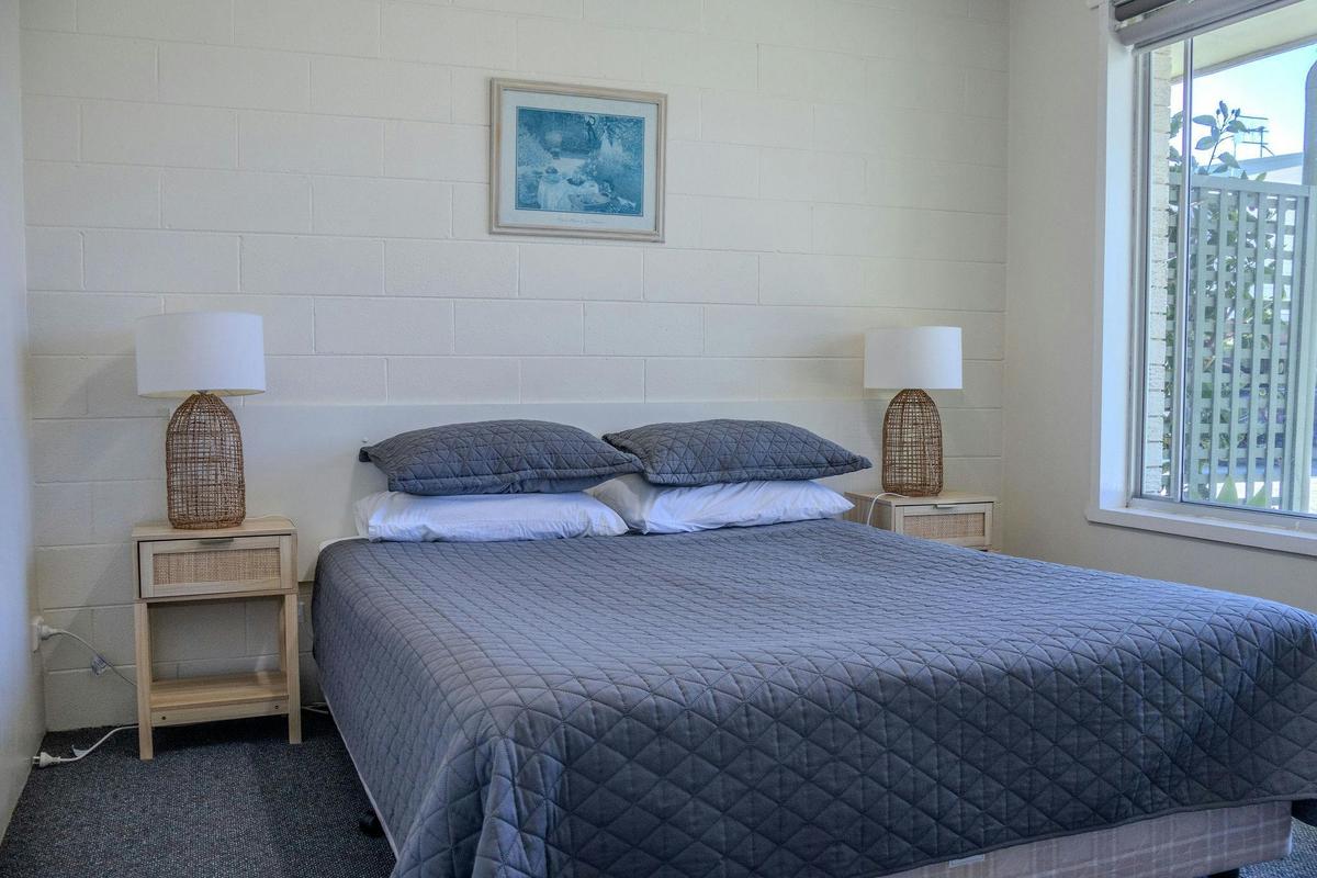 Queen bedroom in a self-contained two-bedroom unit.