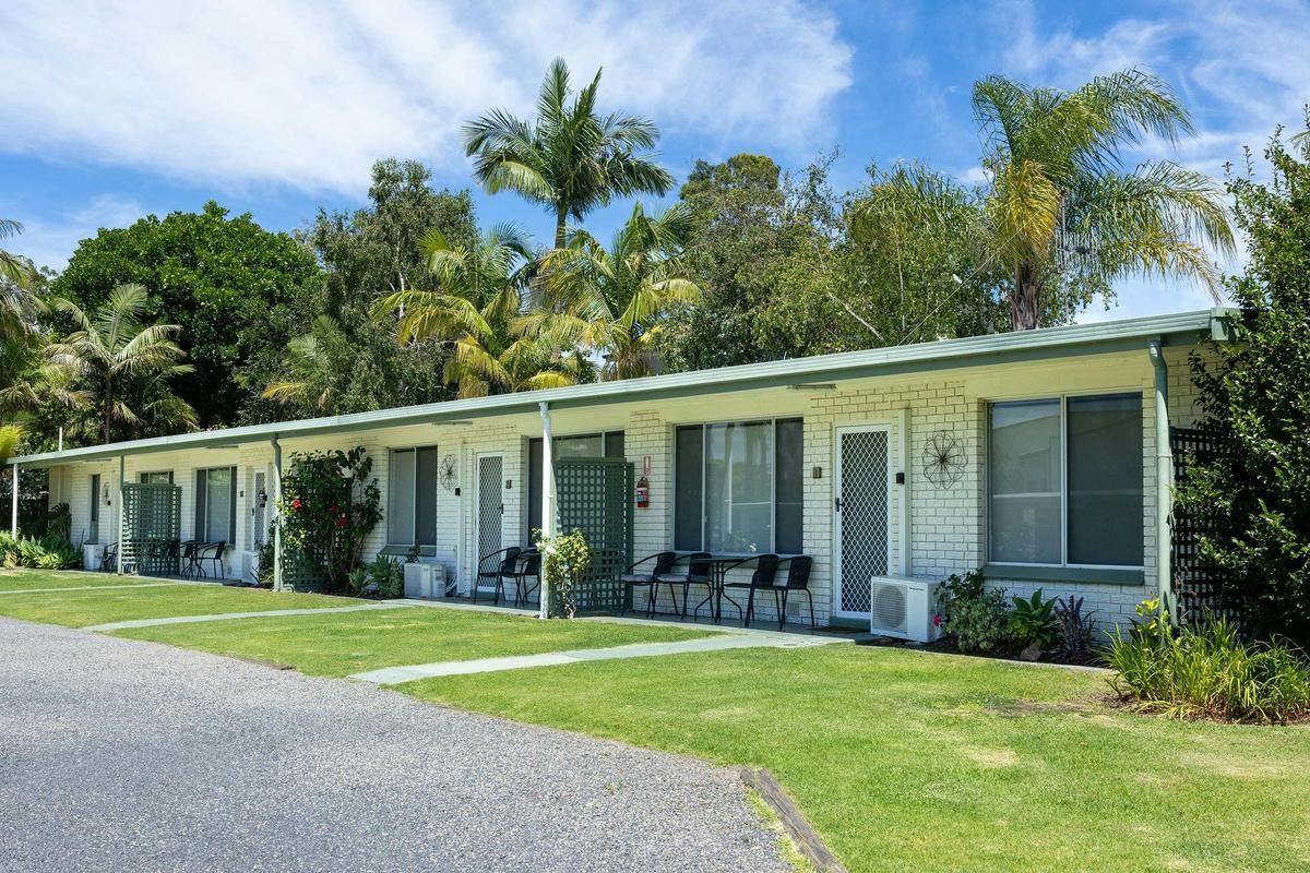 Ground-floor units with outdoor seating, set among established gardens.