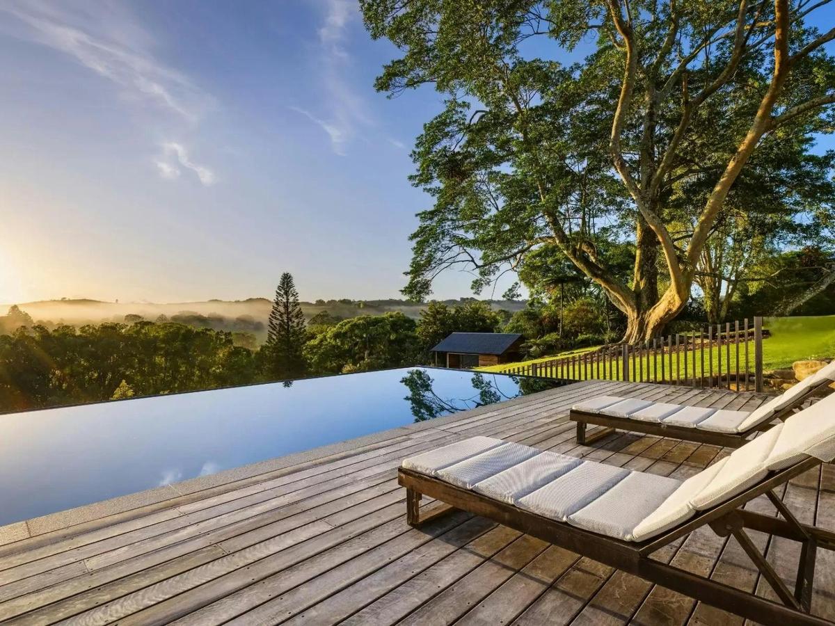 Infinity pool overlooking the rolling Byron hinterland.