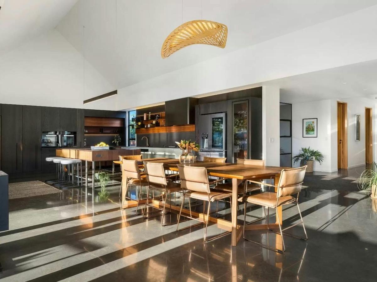 Open plan kitchen and dining designed for gathering.