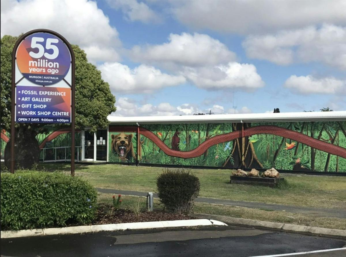 The front entry of the attraction is painted with large murals by local artists.