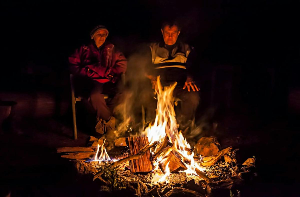 Gathered around the campfire on a cold night