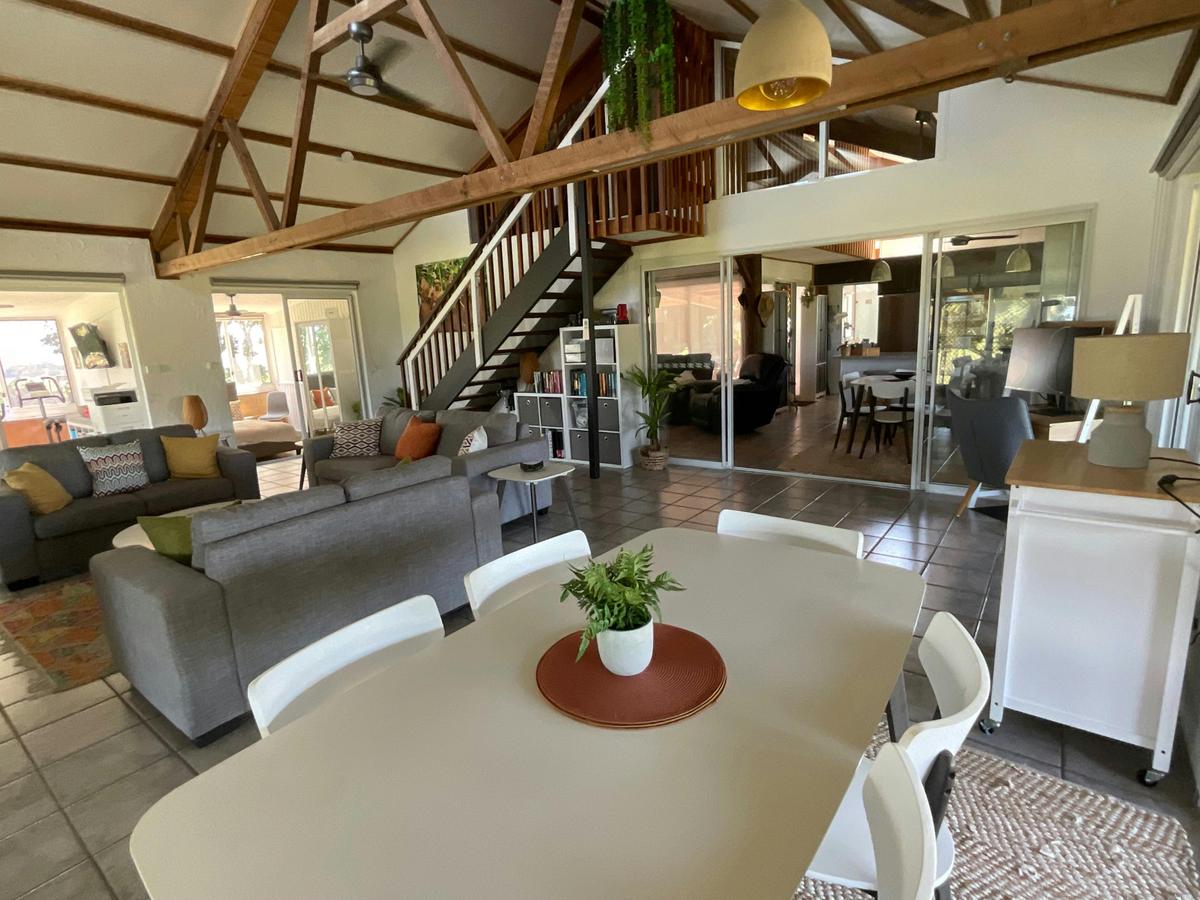 The main lounge/dining area features cathedral ceilings, an electric fireplace, study desk/monitor