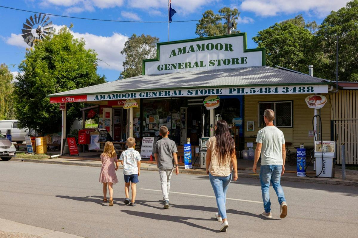Family walking to Amamoor General Store