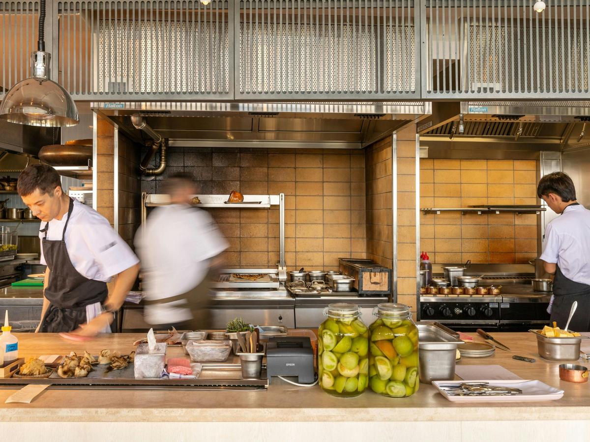 Chefs working in the open kitchen at Aloria