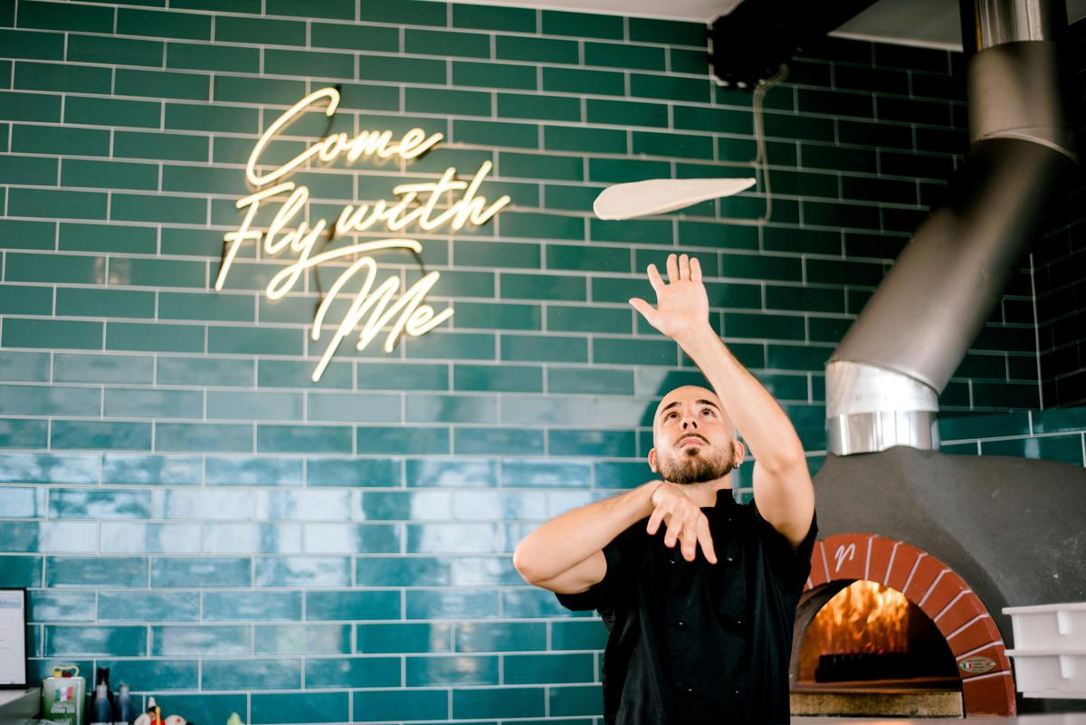Chef Stefano hand crafting traditional Italian pizzas
