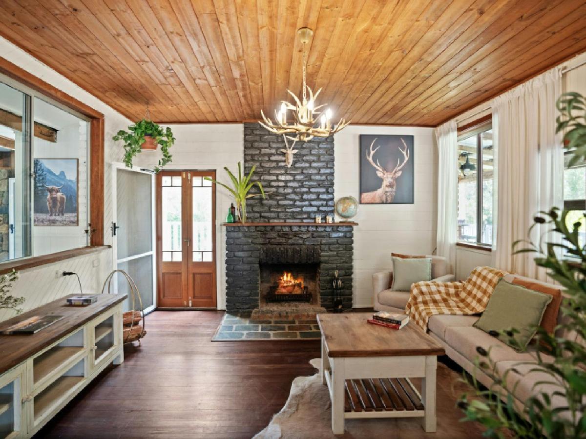 Living room with fireplace and balcony access
