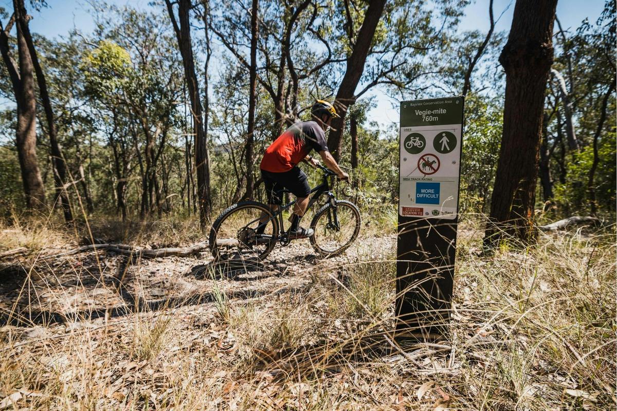 Enjoy a sunny ride along the Vegie-Mite Track through Bayview Conservation Area trails