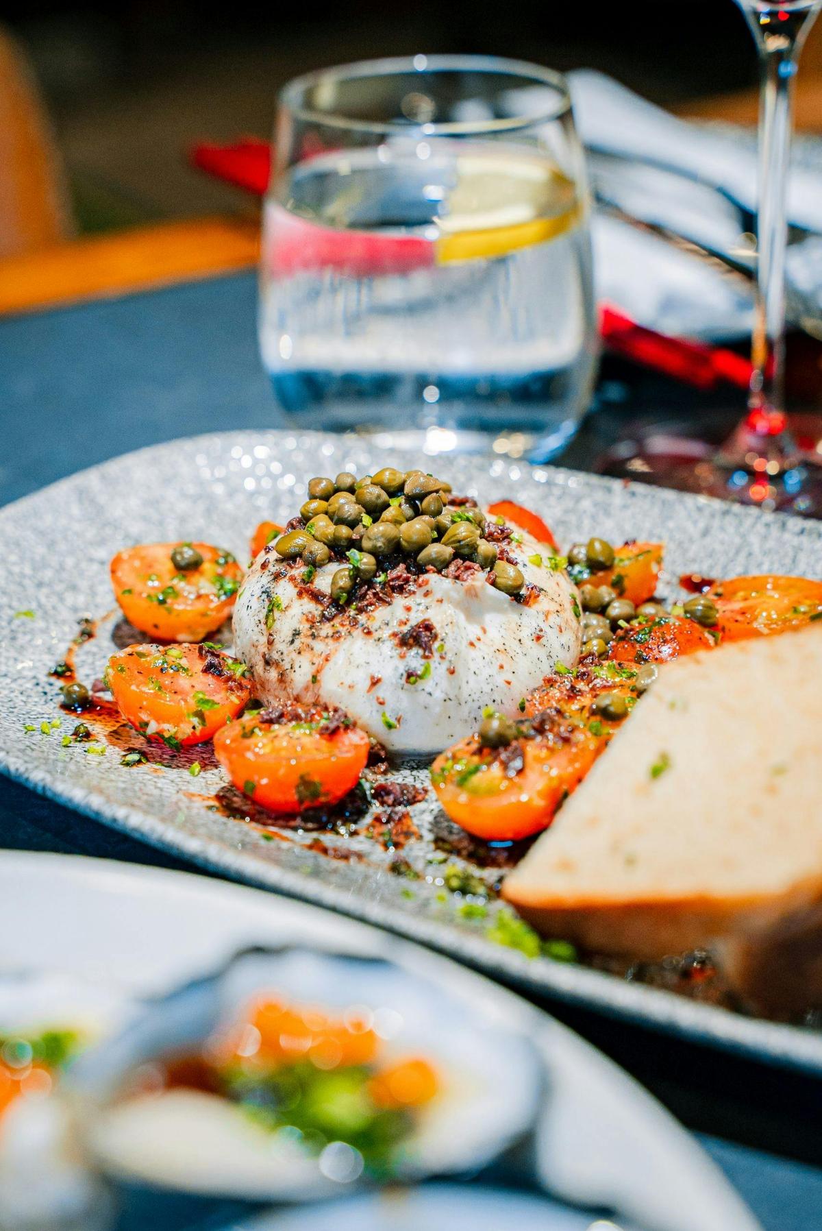 Burrata with cherry tomatoes and capers