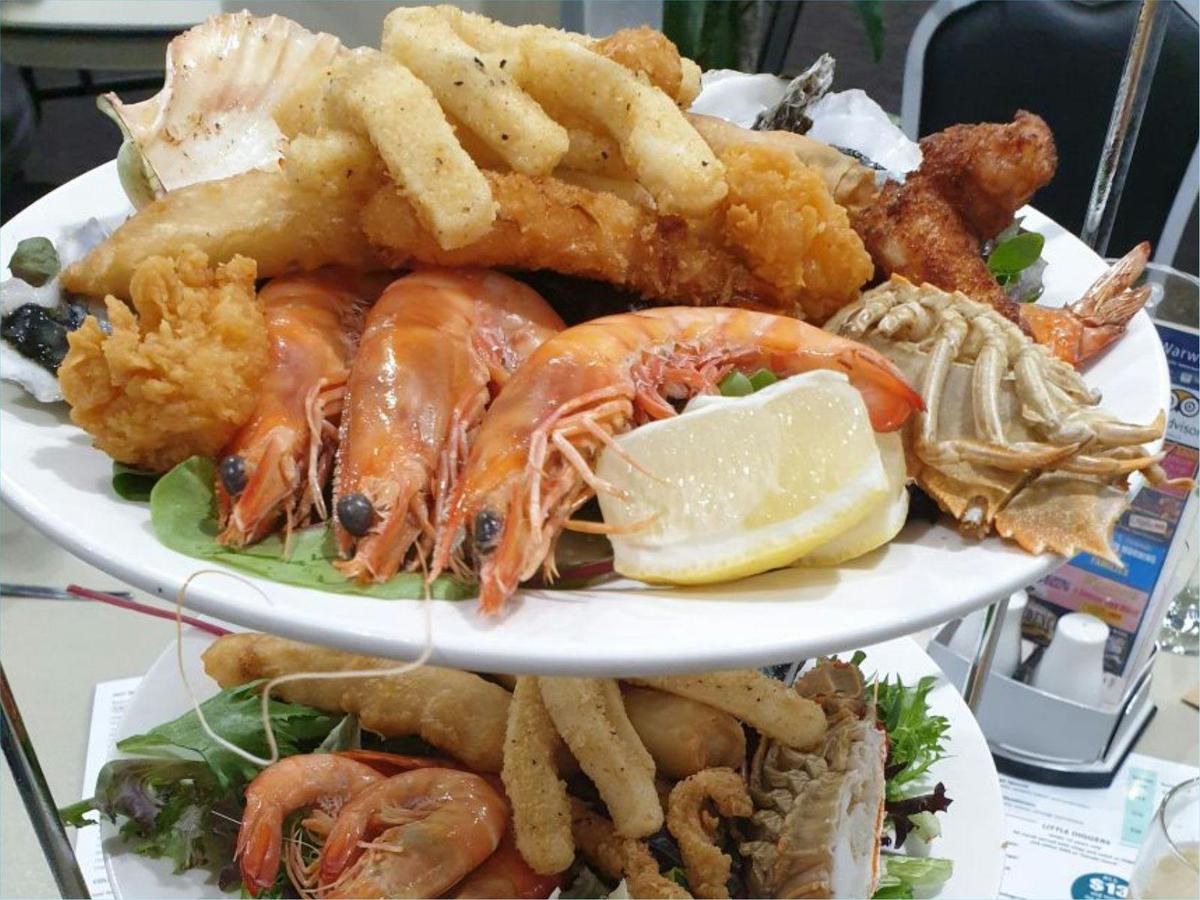 Seafood Tower - 3 plates of fresh and cooked seafood served on the weekend