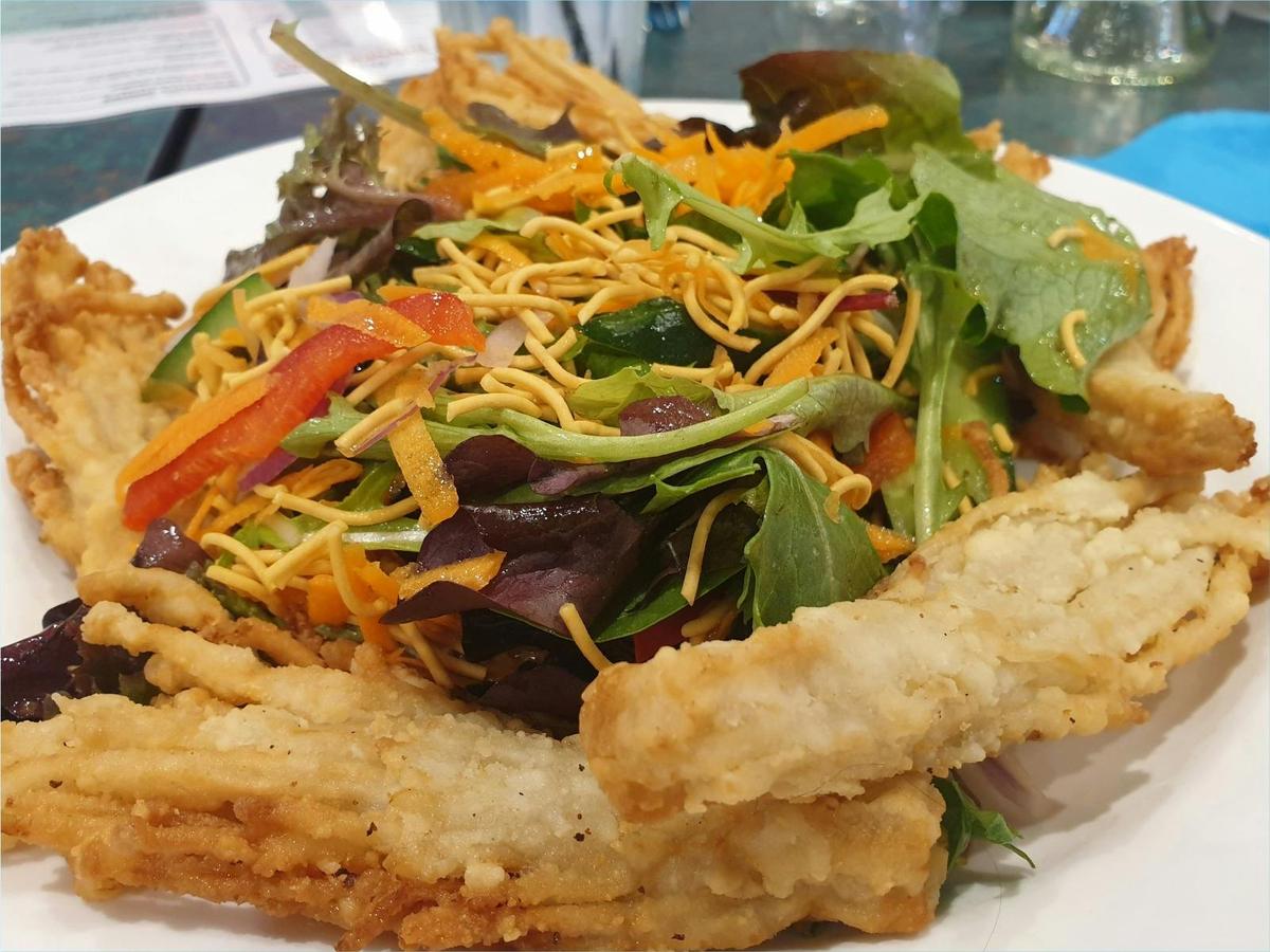 Crispy Enoki Mushrooms dipped in tempura  batter served with crispy noodle salad