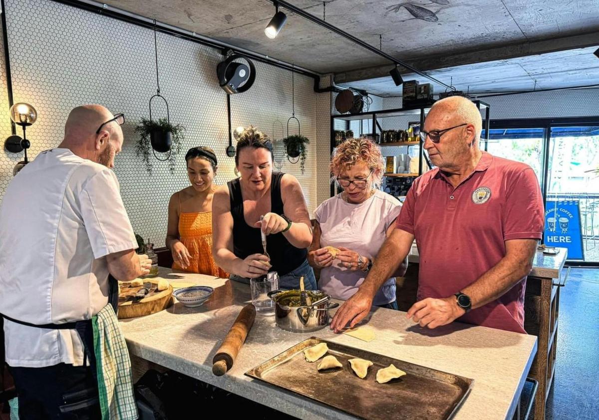 In-house chef teaching an Open Cooking Class learning Indian cuisine