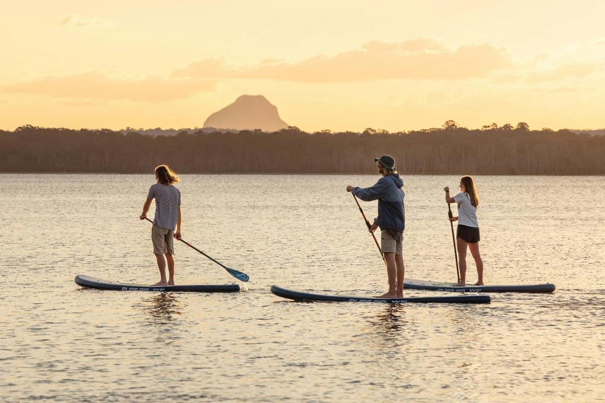Stand Up Paddle boarding on Cootharaba during sunset