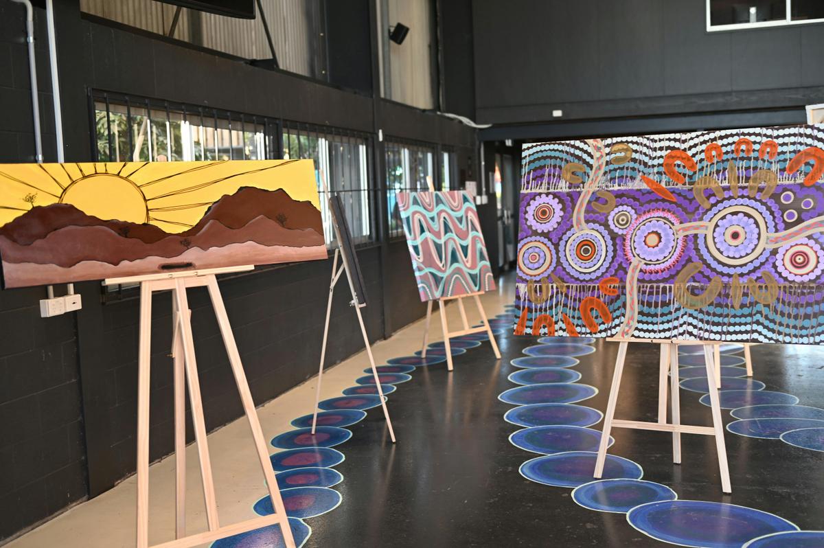 exhibition setup with art