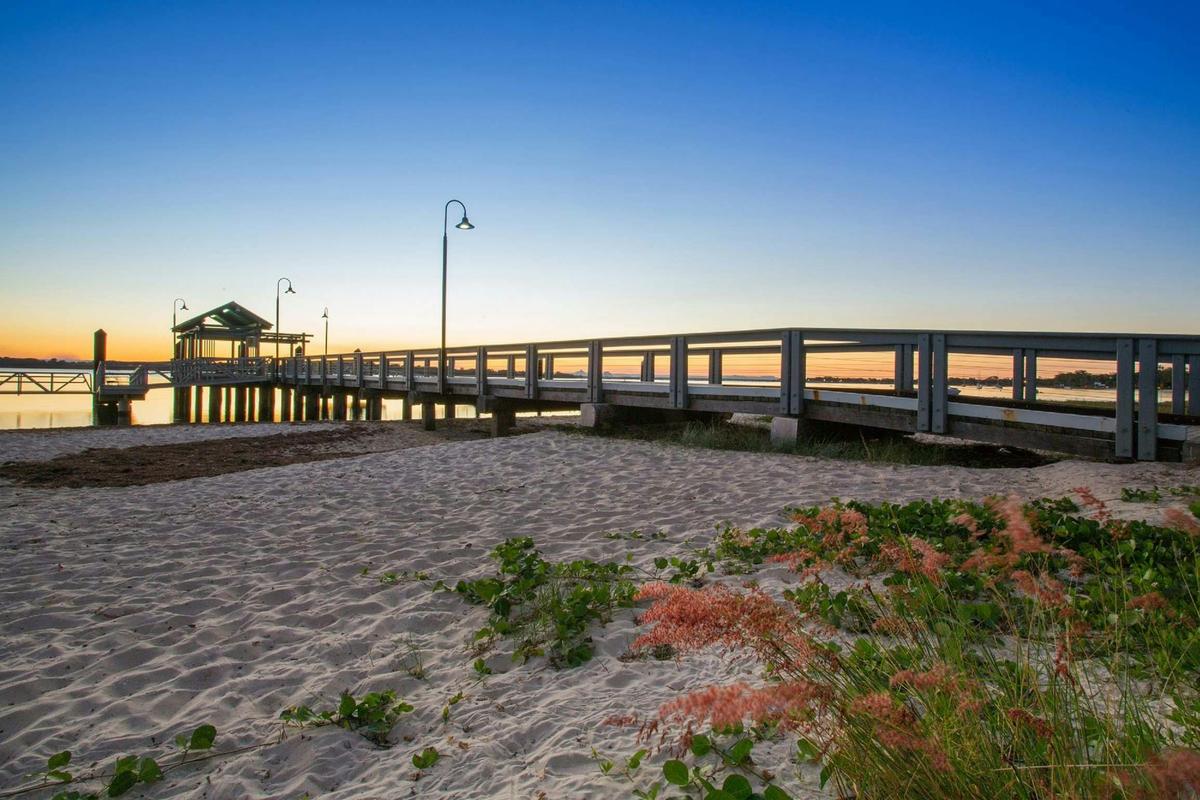 The sun coming down over the Bongaree Jetty