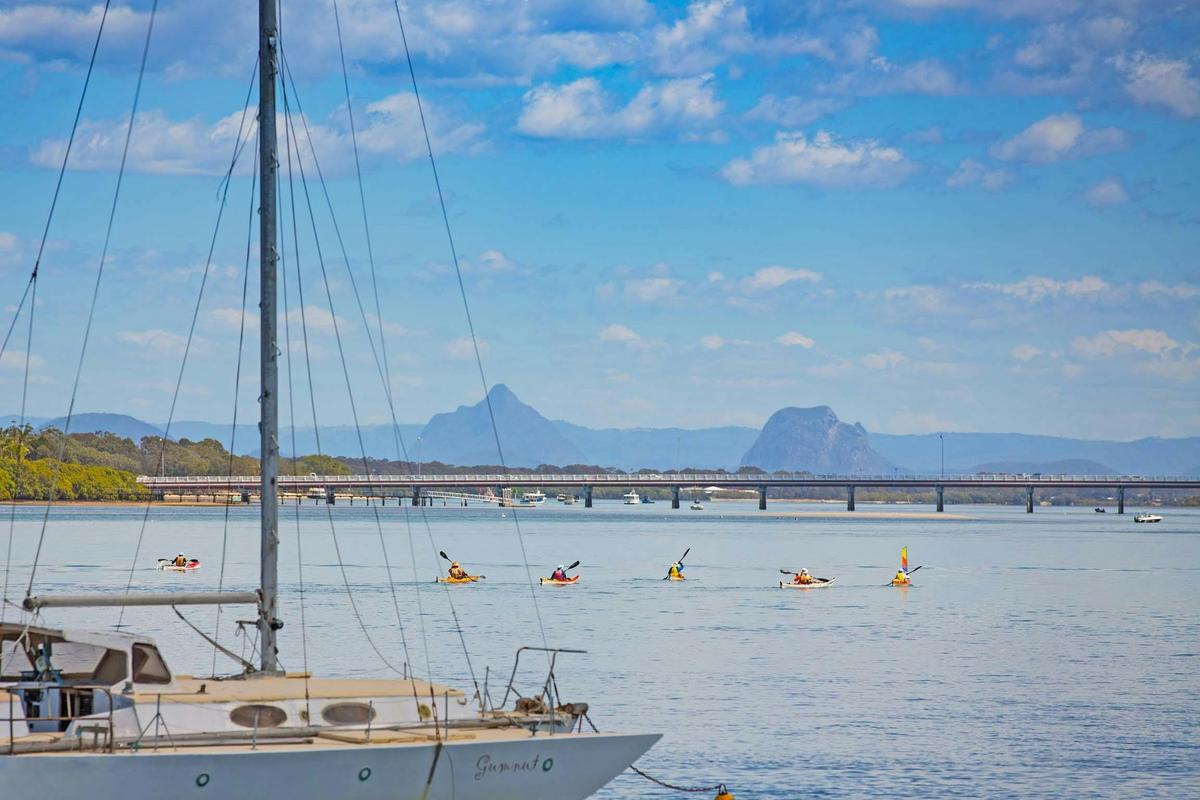 Paddling the Pumicestone Passage with magnificent views of the Glasshouse Mountains