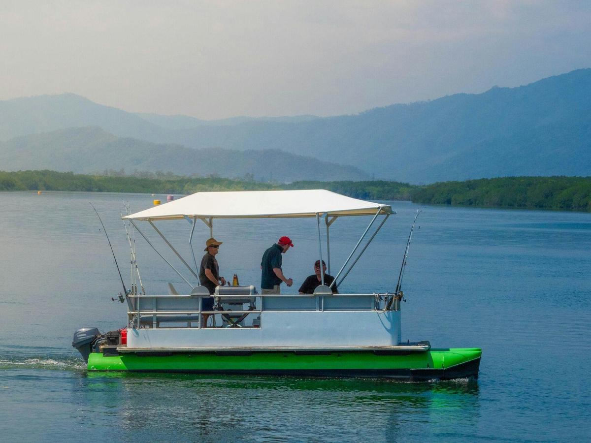 Group of friends fishing on the Trinity Inlet in Tropical North Queensland on a Cairns Boat Hire