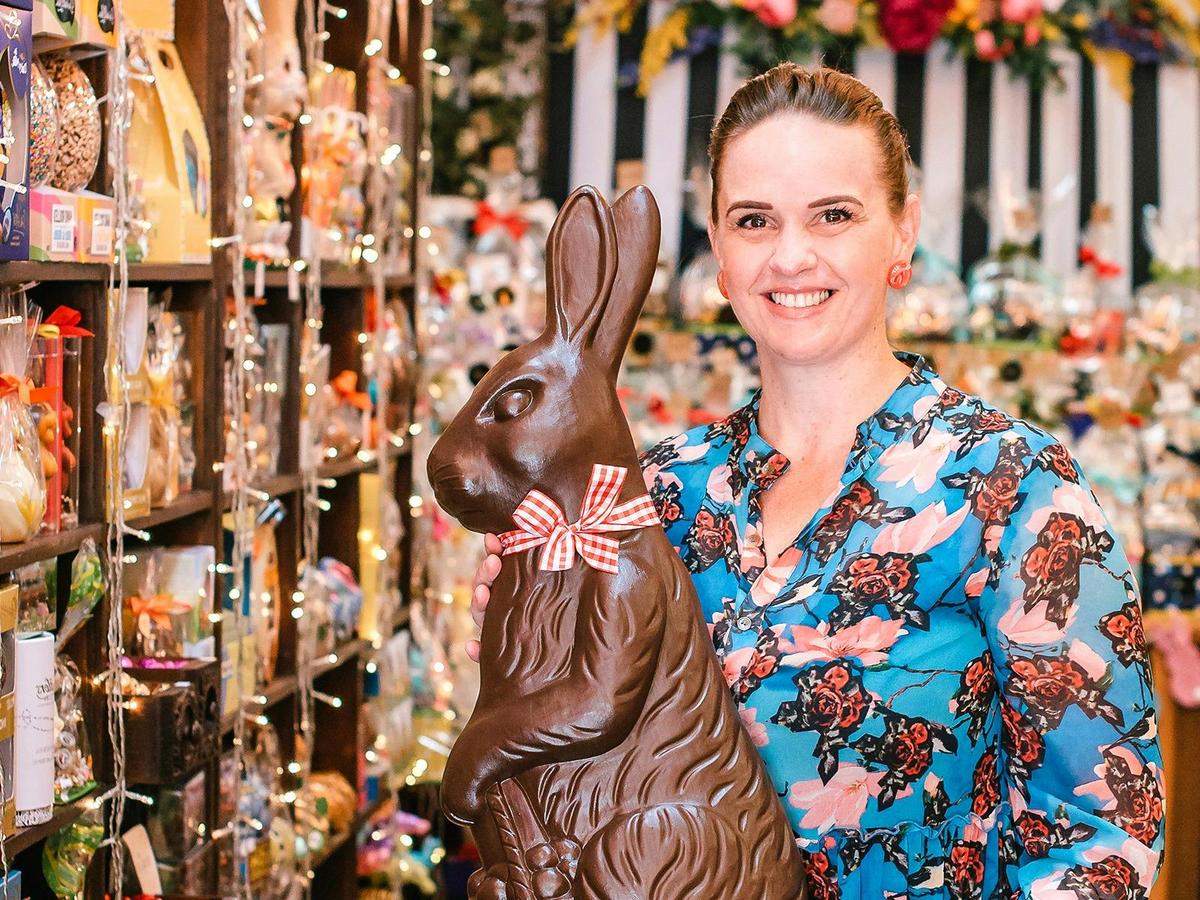 Cha Cha Chocolate owner Melanice Jacobsen with one of our larger-than-life chocolate Easter bunnies.