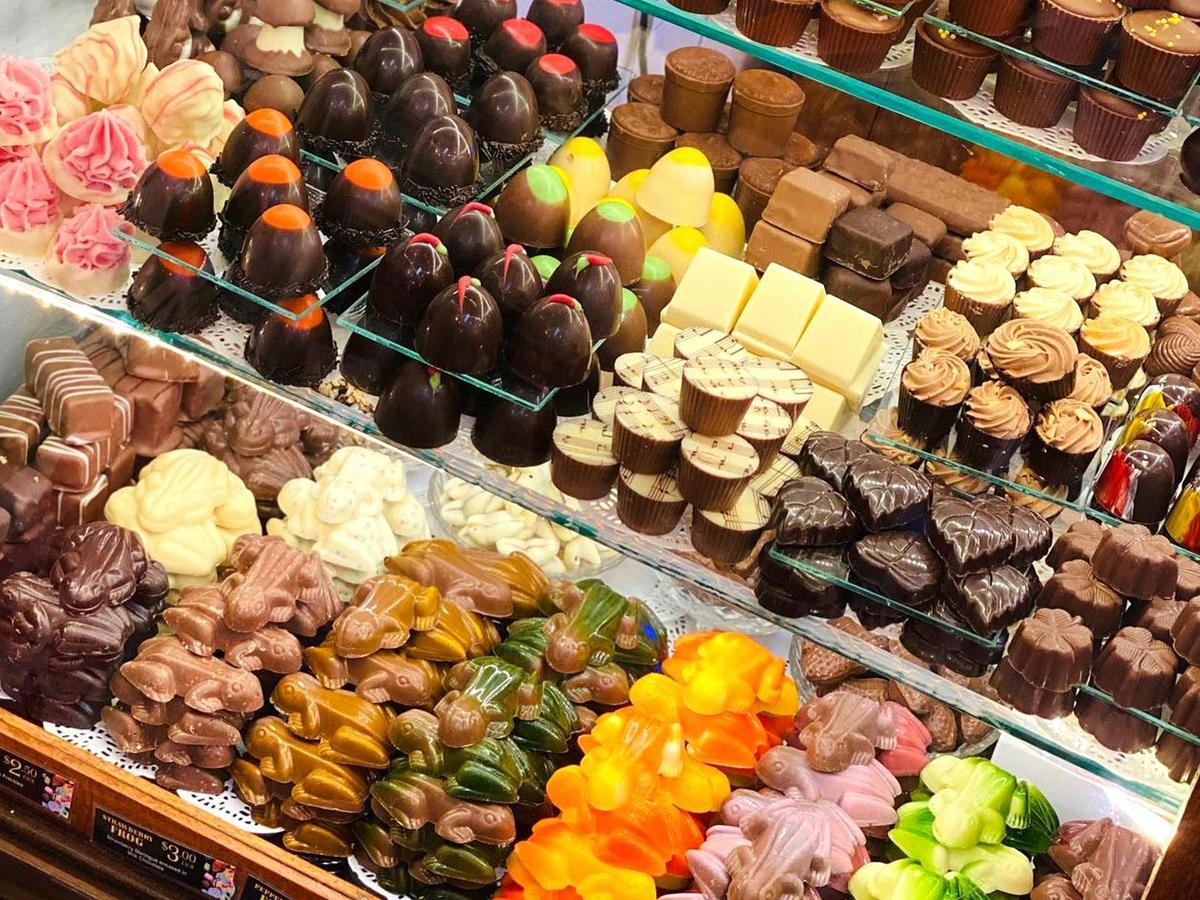 Our Vintage Chocolate Cabinet is filled with handmade chocolates from around the world.