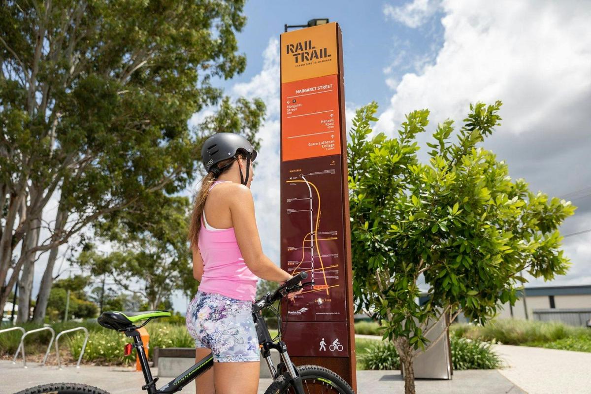 Checking out the map of the Caboolture to Wamuran Rail Trail