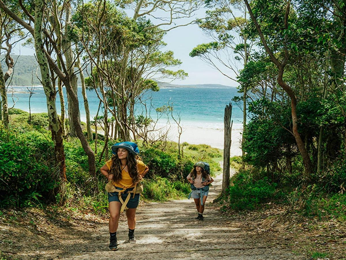 Walkers on the Murramarang South Coast Walk near Depot Beach. Credit: Remy Brand &copy; DCCEEW