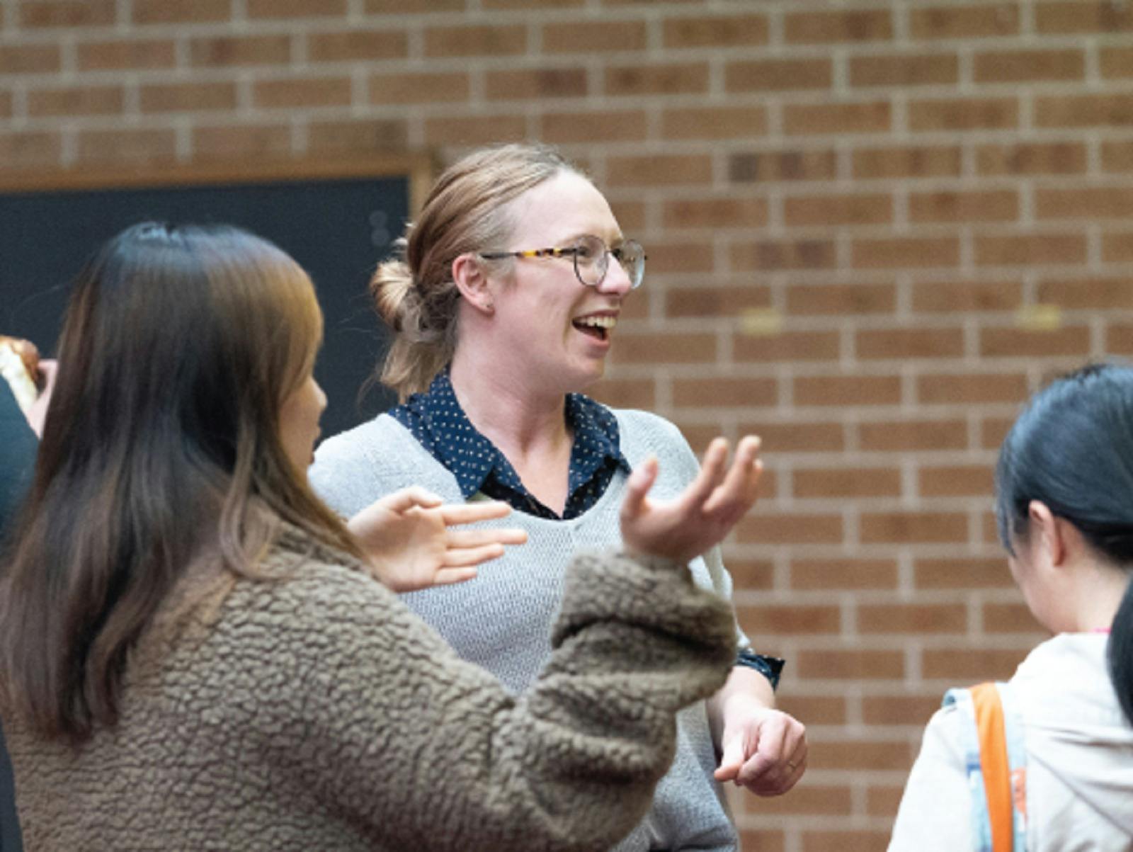 Three women chatting and laughing