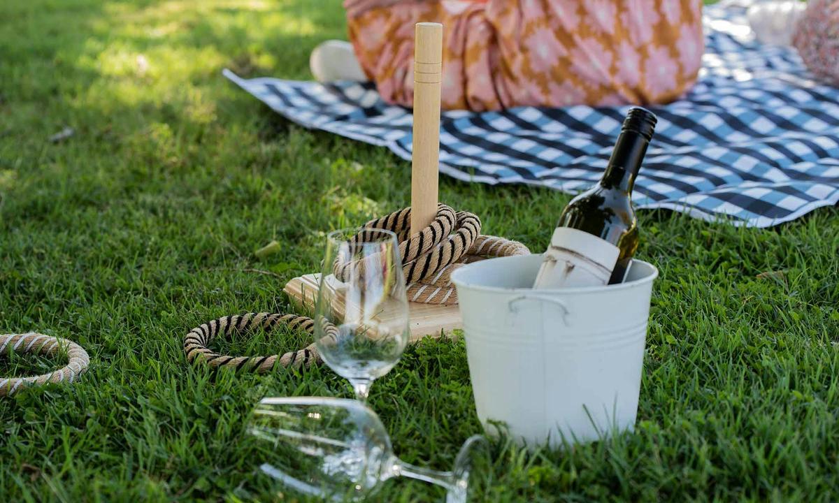 Enjoy lawn games with a glass of wine