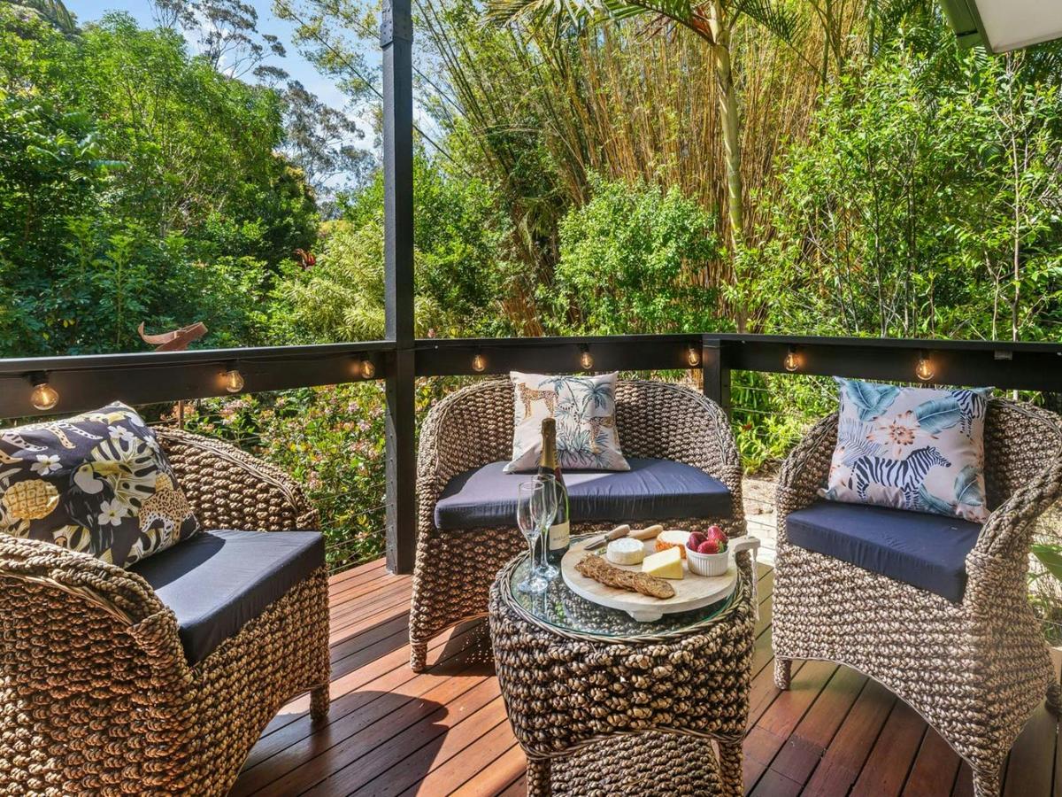 Expansive deck with seating to enjoy the lush hinterland and fresh air.