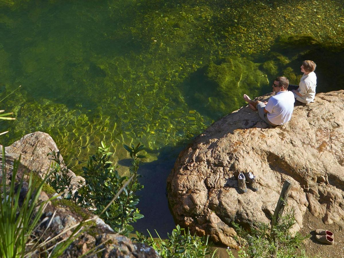 Relax by the rock pools at the end of the steps at Rocky Hole.