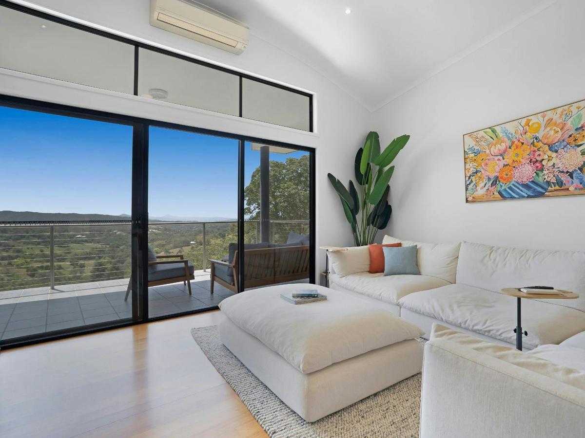 Living room with balcony access, Smart TV and indoor fireplace