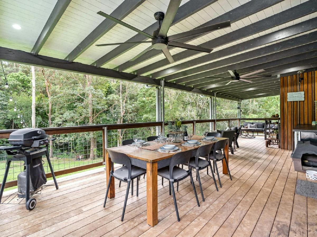 Balcony with outdoor dining and sitting areas