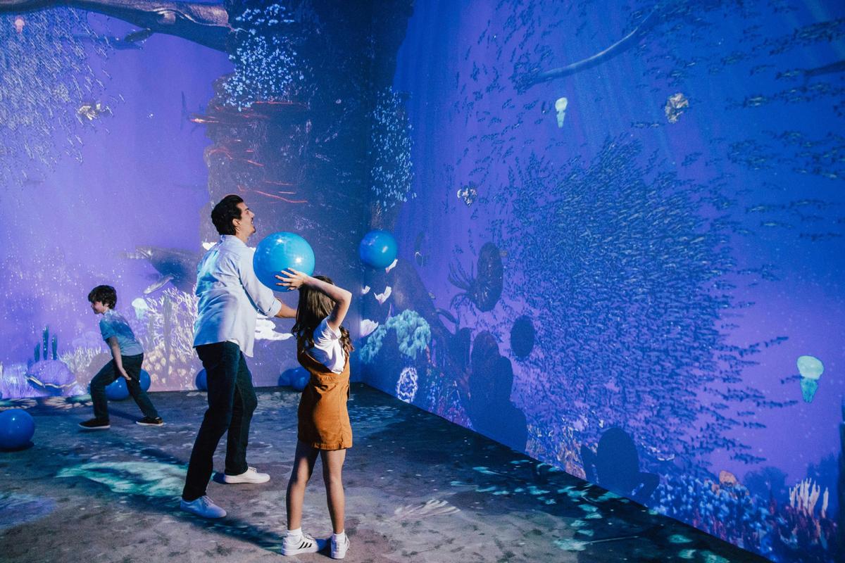 Family plays in immersive room